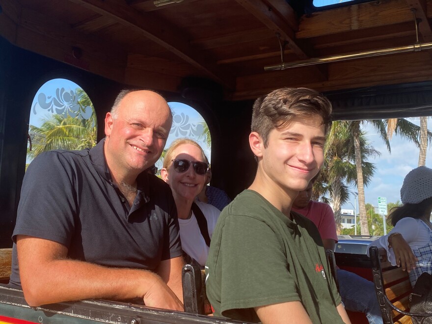 Daniel Sakellarios at front, with his parents, on the Newtown trolley that takes people through historic sites in Sarasota