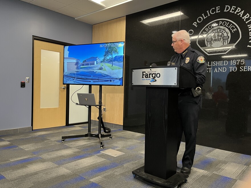 Fargo Police Chief Dave Zibolski showing dashcam video from an officer involved shooting earlier this summer to reporters