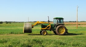 A farmer hauls hay in central Oklahoma.