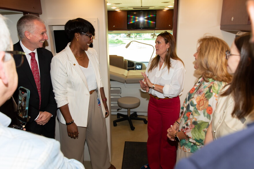 Dr. Shane Speights and Dr. Brookshield Laurent of NYIT College of Osteopathic Medicine at Arkansas State University provide Arkansas Governor Sarah Huckabee Sanders and Secretary of Health Renee Mallory with a tour of the medical school's "Delta Care-a-Van" mobile health unit during Sanders' Aug. 11 visit to the Jonesboro campus. On Thursday, Sanders awarded NYITCOM at A-State with a $1.5 million grant to be used for a maternal health initiative, and the med school will devote a portion of the grant funds to purchase a second mobile health unit to be used for maternal health care.
