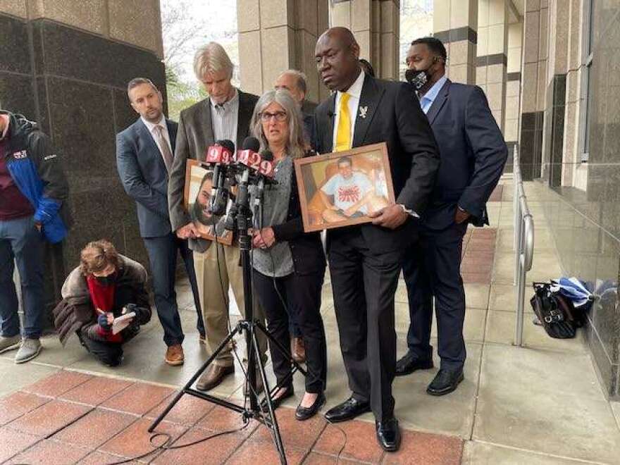 Attorney Ben Crump (Front-R), mother Sara Walker (Front-C), and Thomas Walker (Front-R) annouce a lawsuit alleging the wrongful death of Caleb Walker. Photo: Nicole Darden-Creston, WMFE