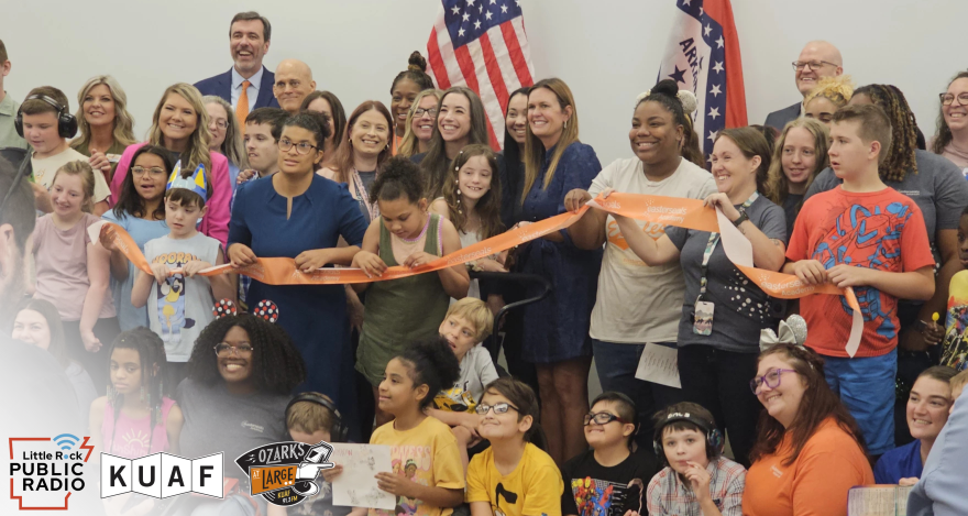 Gov. Sarah Huckabee Sanders, with students and staff, cut the ribbon to Easterseals Arkansas Academy in West Little Rock.