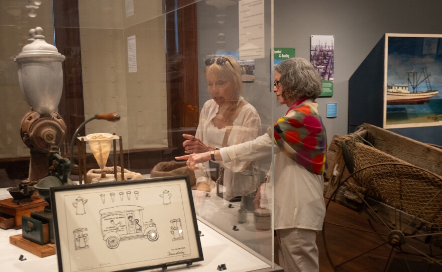 Two women look at a museum display 