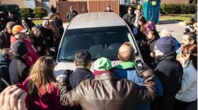 Samuel Oliver-Bruno's supporters surround an ICE agents' car outside the U.S. Citizenship and Immigration Services office in Morrisville, North Carolina.