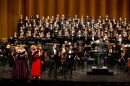 Teddy Abrams conducting the Louisville Orchestra, chorus and soloists