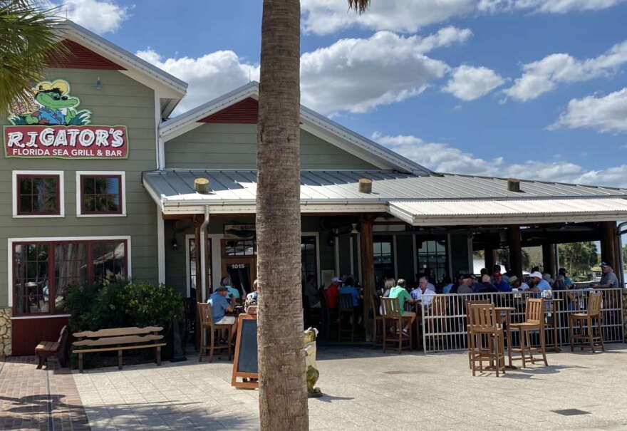 Customers pack the patio bar and tables at RJ Gators in Lake Sumter Landing in The Villages Friday afternoon. Photo: Joe Byrnes