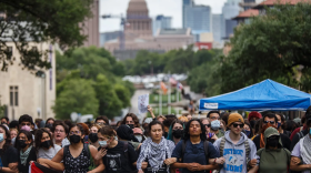 Student protesters link arms during a demonstration on the South Mall lawn at the UT-Austin campus on April 24, 2024.