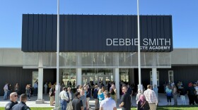 Community gathered outside of Debbie Smith CTE Academy for ribbon-cutting ceremony.