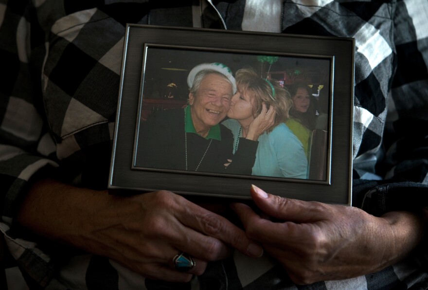 Ellen Bethea holds a picture of herself and her late husband, Archie.
