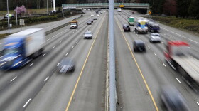 FILE - In this Monday, March 25, 2019, file photo, cars and trucks travel on Interstate 5 near Olympia, Wash. A new study says that safety features such as automatic emergency braking and forward collision warnings could prevent more than 40% of crashes in which semis rear-end other vehicles.