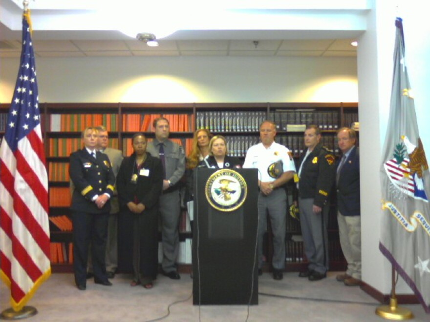 Acting U.S. Attorney Kathleen Mehltretter announces arrests