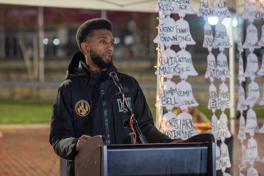 Baltimore Mayor Brandon Scott gives remarks during Homeless Persons’ Memorial Day service in December 2022 at McKeldin Square in Downtown Baltimore. (Philip Muriel for the Baltimore Banner)