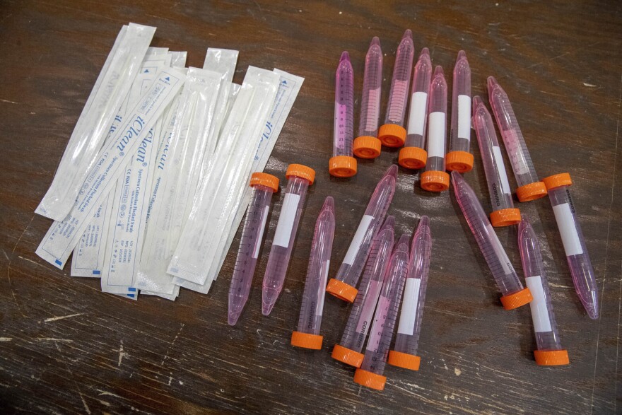 Test swabs and specimen tubes sit on a table at a COVID-19 testing site at the Abyssinian Baptist Church  in the Harlem neighborhood of New York. (Mary Altaffer/AP)