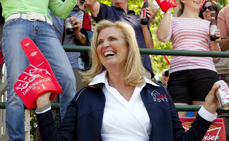 Ann Romney wears a "Dressage is no. 1" foam finger at a qualifying round in June.