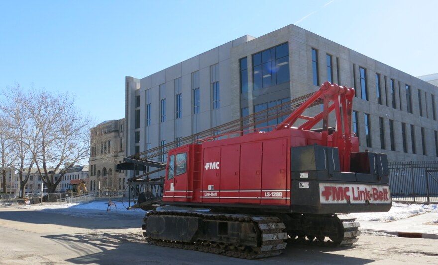 A crane has been moved to 2nd Avenue's 1300 block near the 122-year-old courthouse. 