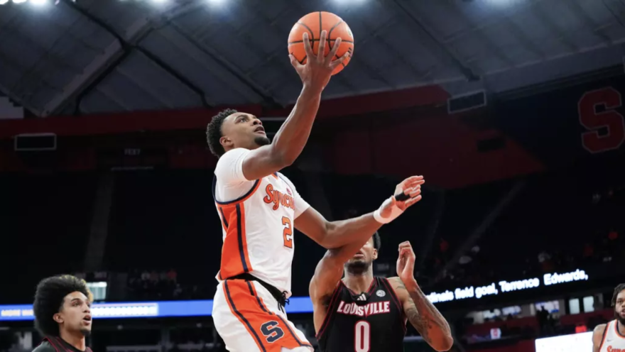 Syracuse guard JJ Starling (2, Orange) drives for layup against Louisville Tuesday night.