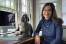 Cleveland State University professor Samantha Baskind in her home study with a copy of her new book on Moses Jacob Ezekiel, and a bronze bust of Franz Liszt by the artist.