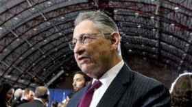 Former New York State Assembly Speaker Sheldon Silver, wearing a navy suit, white shirt and burgundy tie.