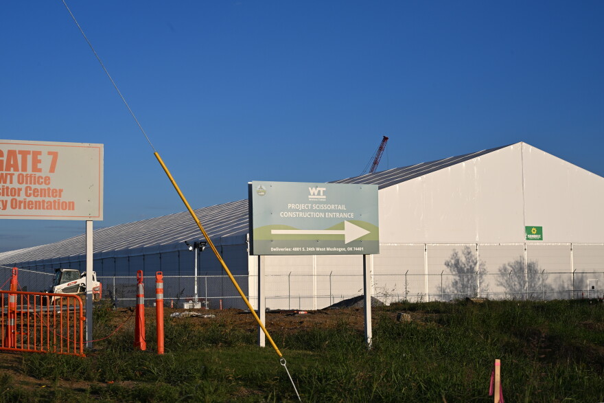 A sign directs drivers to the construction entrance for Google's Project Scissortail in Muskogee County. Google announced in late 2025 it was behind the new infrastructure.