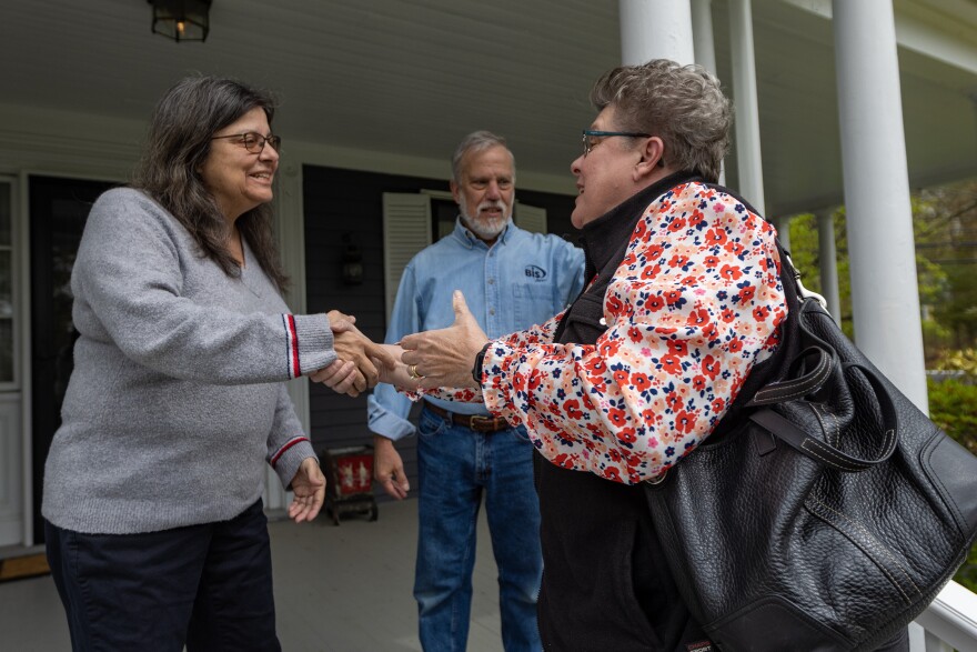 Jan Rohwetter greets Donna Savastio and John Shambroom at their house. Rohwetter shared that she lost her mom recently after a long bout with dementia. "This is something that I would have loved to have been able to do for my mom," she said. "That's why I'm here."