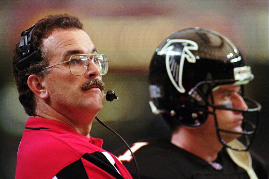 FILE - Atlanta Falcons head coach June Jones watches the clock while standing on the sidelines with quarterback Jeff George (1) during the game against the St. Louis Rams on Nov. 19, 1995.
