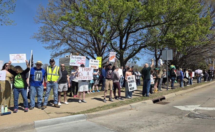 Protesters hold up signs at Dream Keepers Part for Tulsa's "No Kings" rally on Saturday, March 28, 2026.