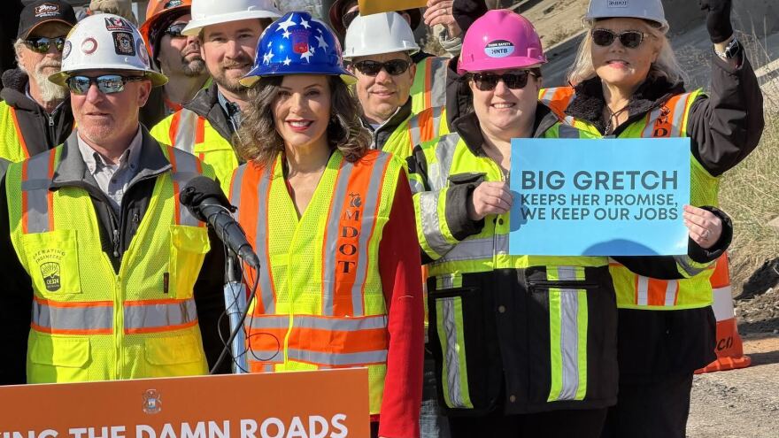 Governor Gretchen Whitmer in a customized hard hat celebrates the opening of the final road construction season of her administration.