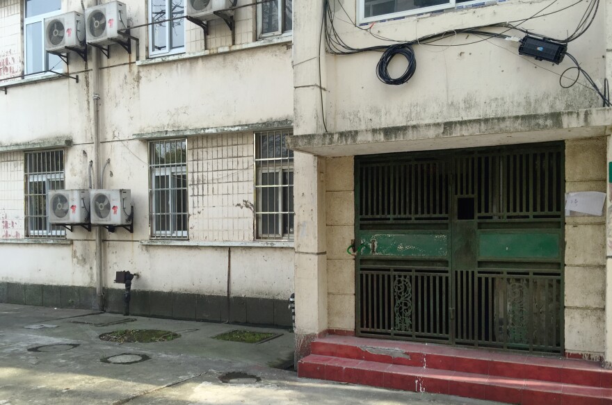 An abandoned, five-story dormitory at Baosteel sits on the outskirts of Shanghai. The steel company has been moving production out of the city and workers have quit, following salary cuts tied to low steel prices.