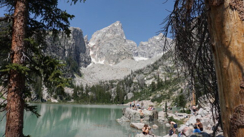 Hikers soak in the views at Delta Lake in Wyoming’s Grand Teton National Park in late July 2026.