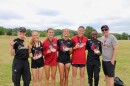 The University of Louisville women's track team posing for a photo after a track meet