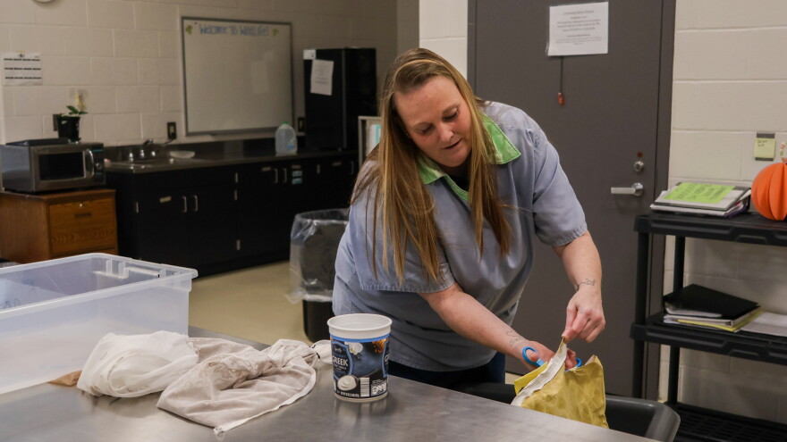 Emily Bush, who is incarcerated at Ohio Reformatory for Women in Marysville, prepares a mealworm farm, Oct. 15, 2026. Women at the reformatory breed mealworms for Ohio Wildlife Center. The worms feed rescued reptiles and birds.