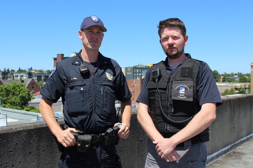 Officer John Hill and Ryan Miles, a designated mental health professional with the Tacoma Police Department.