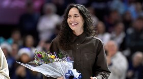 Sue Bird smiles during a ceremony retiring her number before an NCAA college basketball game between UConn and DePaul, Sunday, Dec. 7, 2025, in Storrs, Conn.