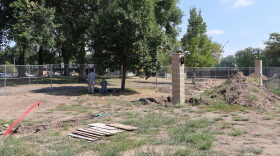 A member of the State Historical Society of North Dakota and a member of the North Dakota Geological Survey perform soil tests on Aug. 26, 2026, near the governor’s residence where human remains were discovered as part of a fence and driveway project on the Capitol grounds.