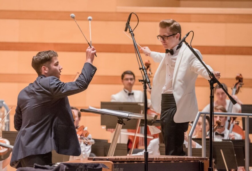 Piotr Waclawik, right, conducting in the Benedict Music Tent at the Aspen Music Festival and School.