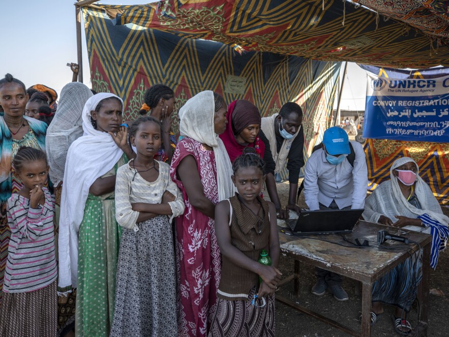 Refugees who fled a conflict in the Ethiopia's Tigray Region wait to register their names for a convoy to transfer them to Umm Rakouba refugee camp in eastern Sudan earlier this week.