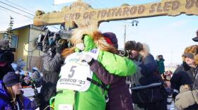 two people hug in finish chute