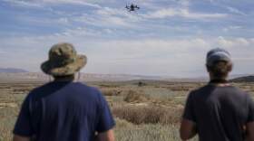 Tim Wallace, left, and Phinehas Lampman use drones to study how coccidioidomycosis, or valley fever, travels through the air.
(Carolyn Van Houten/The Washington Post via Getty Images)