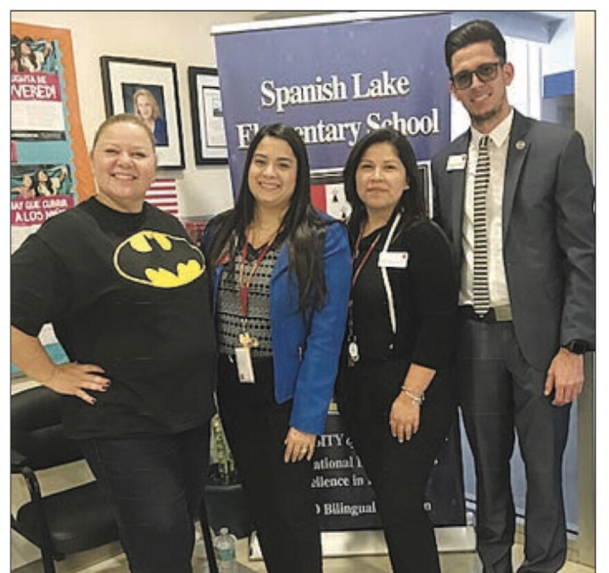 Spanish Lakes Elementary principal Jaquiline Arias-Gonzalez (left) with Teach-A-Thon participants Jessica Saavedra, Luisa Uribe, and Hector Rodriguez.