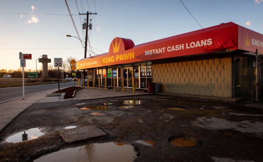 A store clerk at King's Pawn Shop says that people often find the shop by looking for the cross.