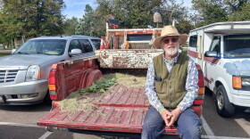 David Temple sits in an empty truck bed after handing out trees at the Cortez Public Library.