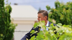 Senator Martin Heinrich looks out from the student garden at Wilson Middle School