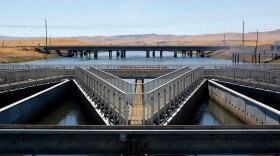 In this Sept. 23, 2013 file photo, water flows through fish diversion louvers at the John E. Skinner Delta Fish Protective Facility from the Clifton Court Forebay on its way to the Harvey O. Banks pumping plant, near Tracy, Calif.