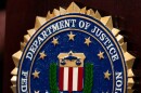 An FBI seal is displayed on a podium before a news conference at the field office in Portland, Ore., Thursday, Jan. 16, 2025.