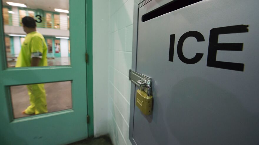 An immigration detainee stands near a U.S. Immigration and Customs Enforcement (ICE) grievance box last month in the high security unit at the Theo Lacy Facility, a county jail in Orange, Calif., that also houses immigration detainees arrested by ICE.