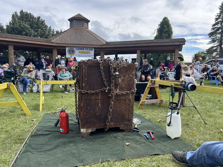 The thousand-pound safe from the 1920s, chained up and unopened. A pair of safe crackers drilled into the concrete safe to reveal it's contents in front of 400 people, on Sunday, September, 20.