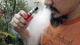 Some physicians are speculating that vaping could make some young people more susceptible to the worst complications. (Jim Mone/AP)