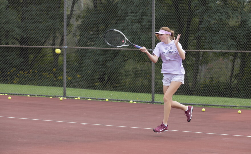 Cara Evans returns a serve during practice.
