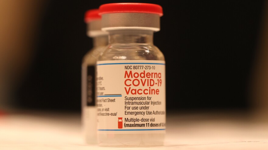 Moderna says its new bivalent vaccine is its "lead candidate for a Fall 2022 booster." Here, a vial of the company's COVID-19 vaccine sits on a table at a vaccination clinic in San Rafael, California.