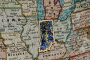A digitally edited image showcasing a virus pattern over top Indiana on a map of the region.